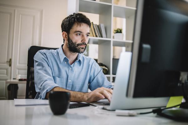 Man focus on laptop DocuSign